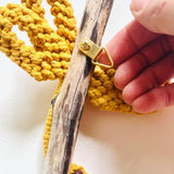 Mustard Dragonfly on Driftwood