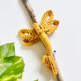 Mustard Dragonfly on Driftwood